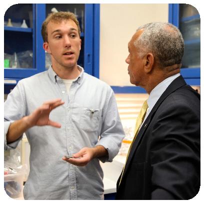 link=https://2011.igem.org/Team:Brown-Stanford/NASA Andre explains our project to Charles Bolden, Administrator of NASA and former astronaut